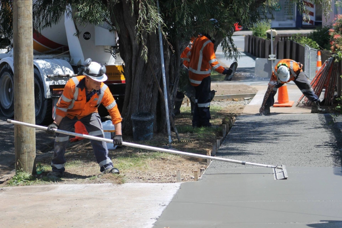 Workers-laying-concrete-path